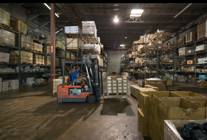 Man operating a forklift in a warehouse