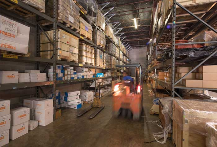Man operating a forklift in a warehouse